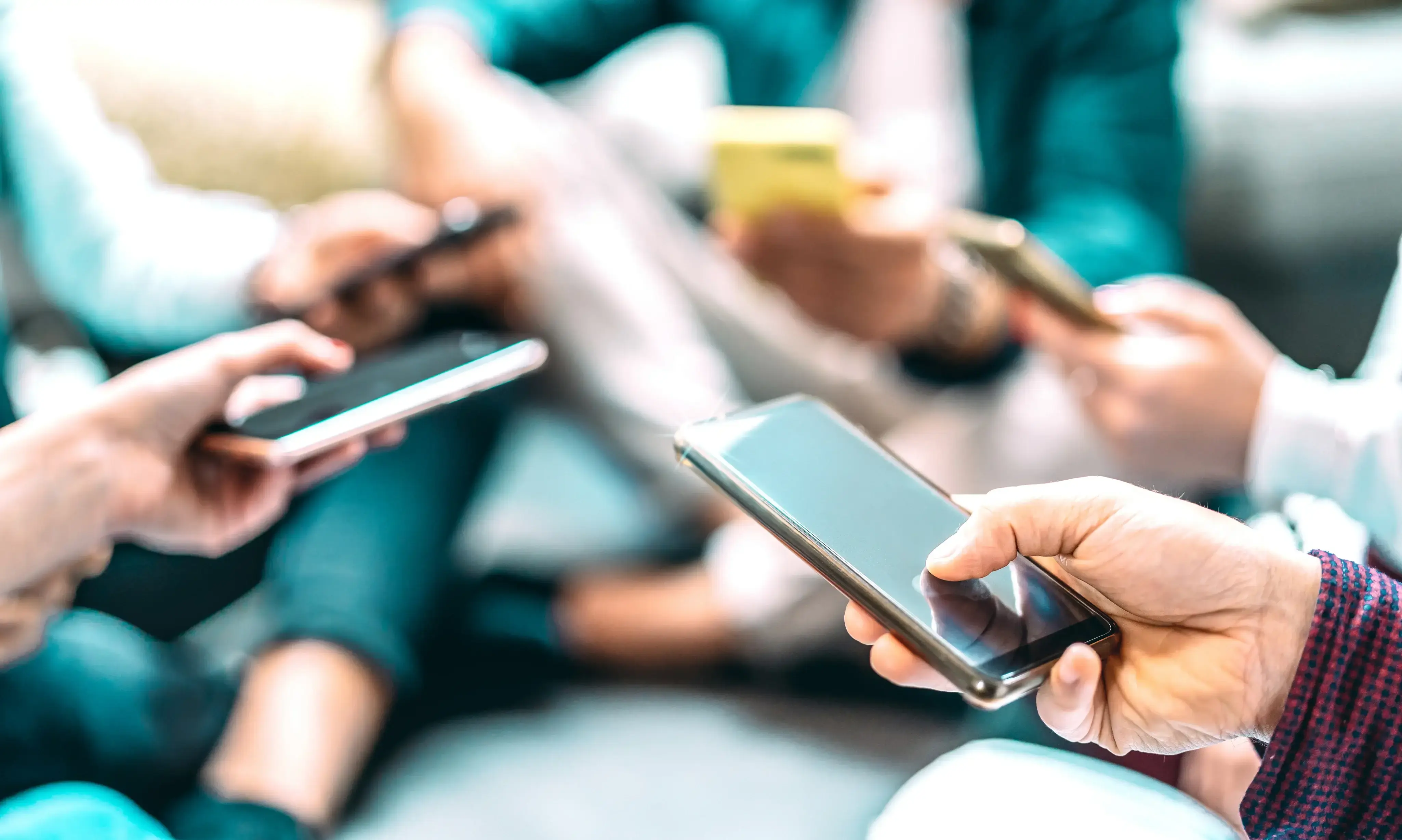 image of people using their mobile phones